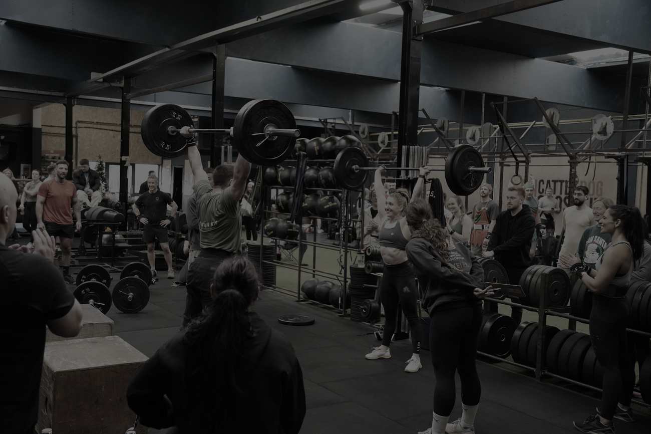 Members cheering on a lifter at a Cattle Dog throwdown
